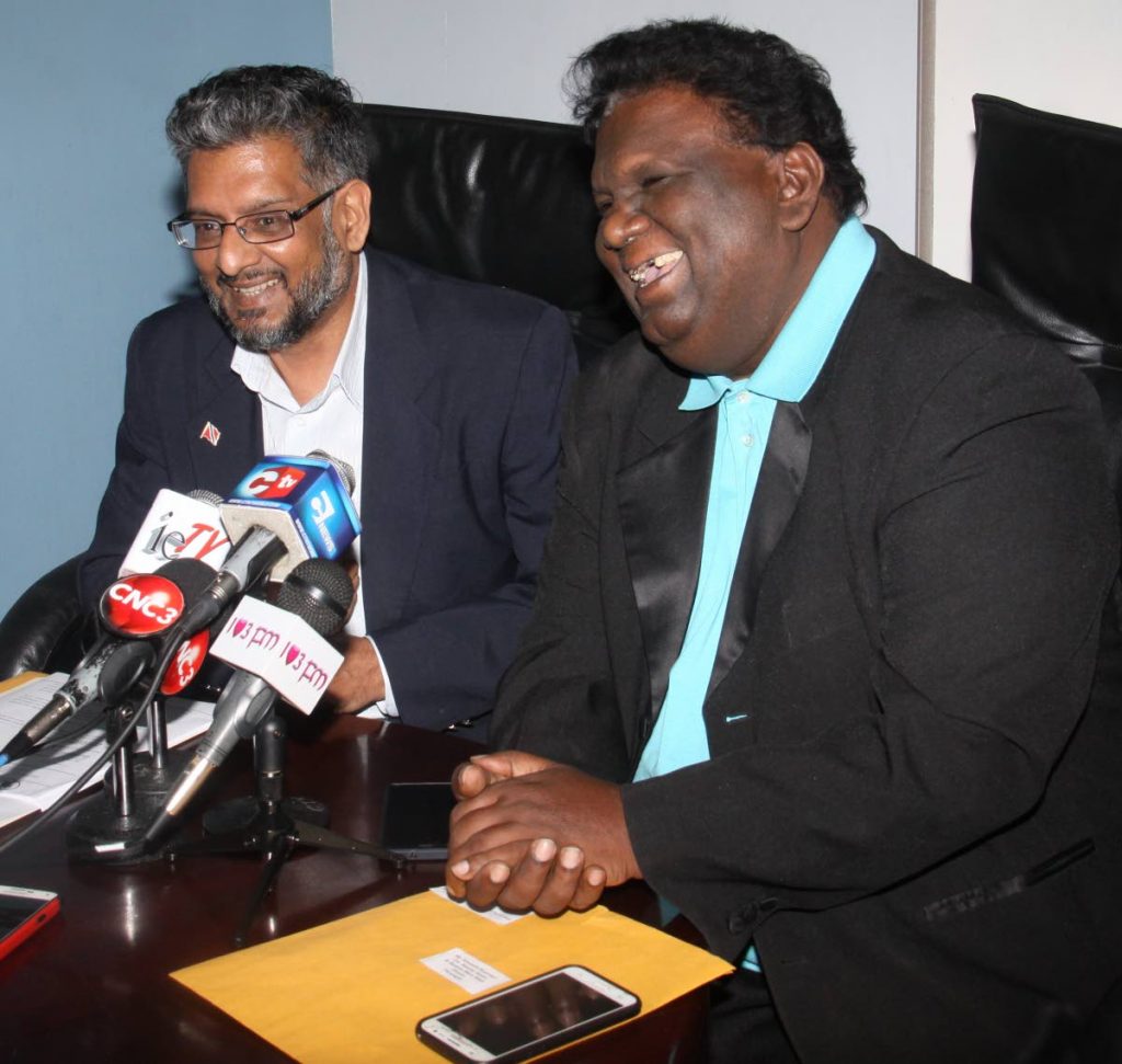 KICKSY KENNETH: Chutney singer Kenneth Supersad, right, and media consultant Devant Maharaj joke during a pres conference yesterday at Regius Law Chambers, Port of Spain.