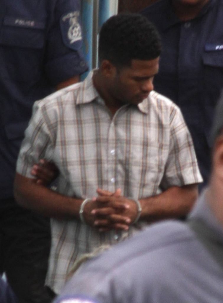 Cpl Kerros Martin, of the TT Defence Force, escorted with other prisoners by officers of the TTPS Court and Process Branch before, appearing before the Sangre Grande Magistrate Court.
PHOTOS BY ROGER JACOB
