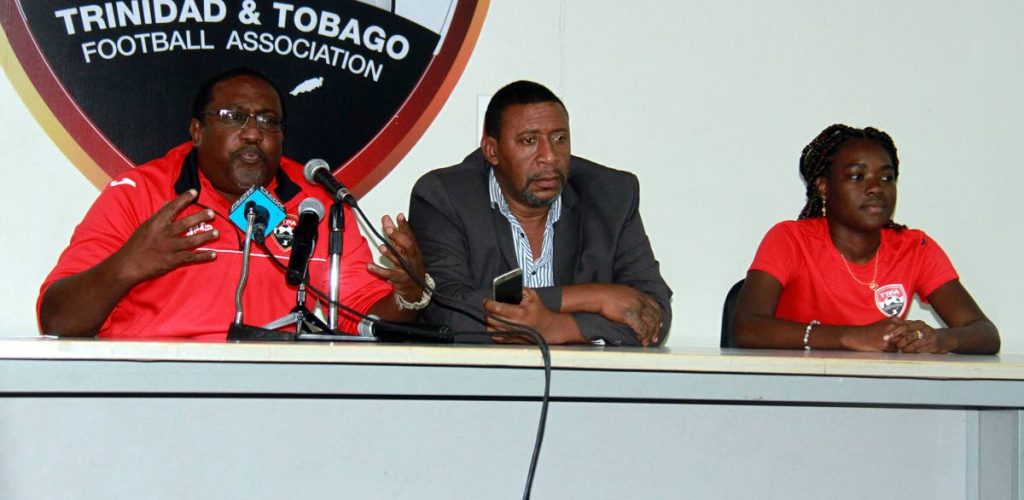 Left to right, Women’s Under-20 football coach Jamaal Shabazz addresses the media yesterday along with president of the TTFA David John-Williams and captain, Natisha John during a press conference for the 2018 CONCACAF Women’s Under-20 Championships and  a training session at the Ato Boldon Stadium, Couva.
