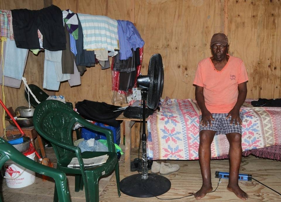 Lazarus St Rose, 71, inside his shack in Moruga in August last year. 