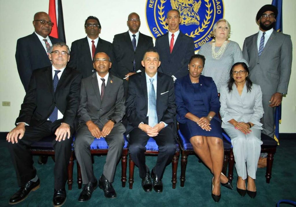 President Anthony Carmona, seated at centre, with members of the Procurement Board at President’s House in St Ann’s.