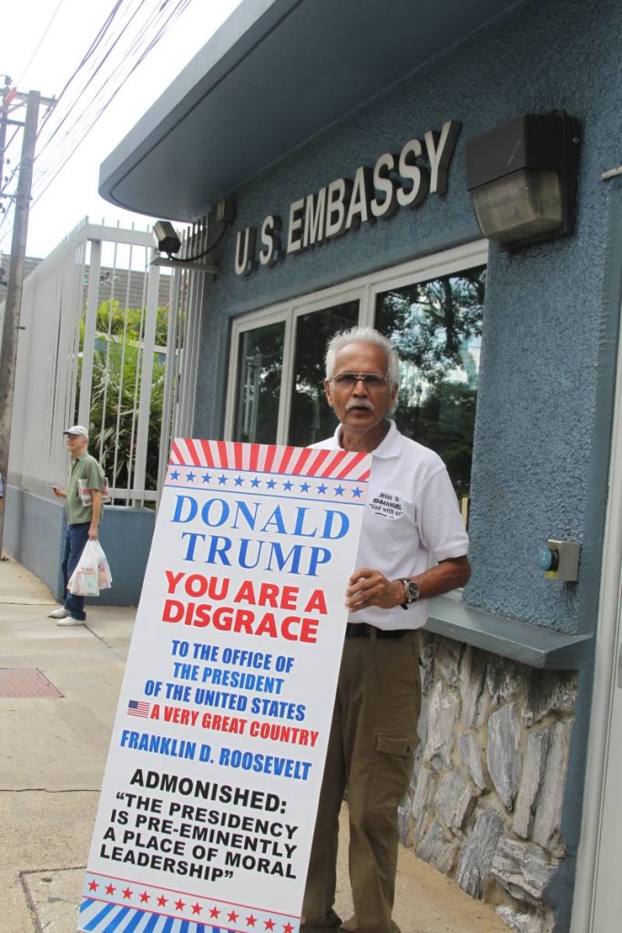 Activist Ishmael Samad protest against US President Donald Trump outside the US Embassy in Port of Spain. 