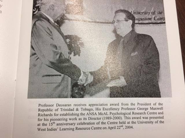 Prof Ramesh Deosaran receives an appreciation award from President Prof George Maxwell Richards for establishing the ANSA McAL Pschological Research Centre and for his pioneering work as its director (1989-2000) at the University of the West Indies, St Augustine Campus on April 22, 2004.