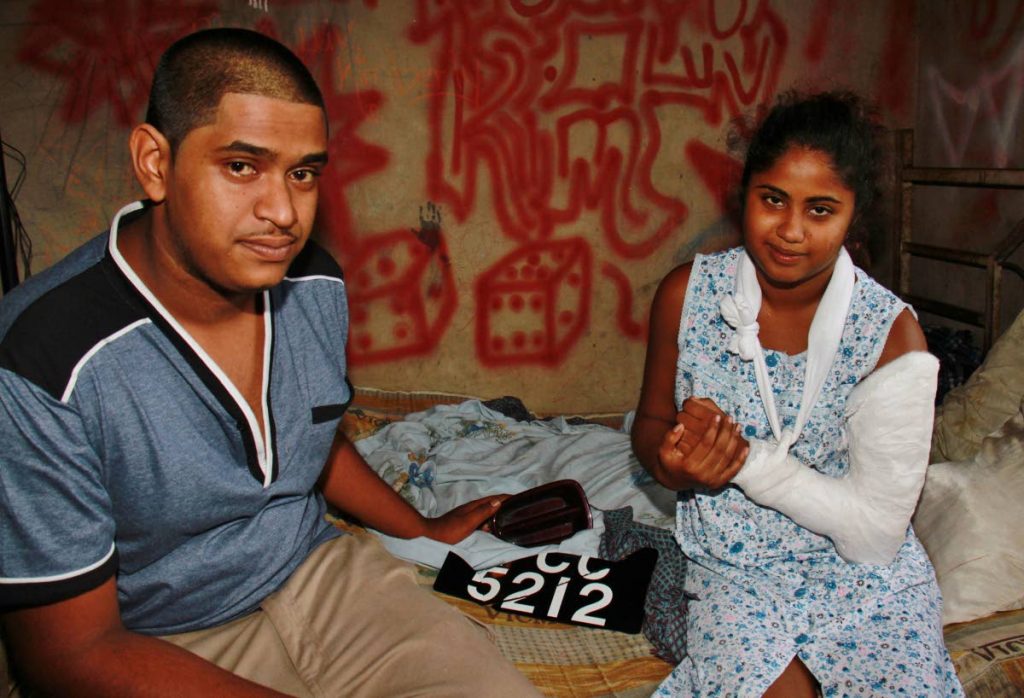 Stephon Nanan with his wife Seema who was discharged from hospital yesterday after surviving a hit and run accident.