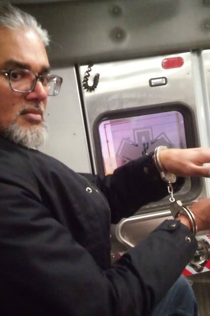 TT-born immigration rights leader and executive director of the New Sanctuary Coalition of New York City, Ravi Ragbir, in handcuffs after being detained by ICE officers in NYC during a scheduled check-in on January. PHOTO COURTESY AMY GOTTLIEB.