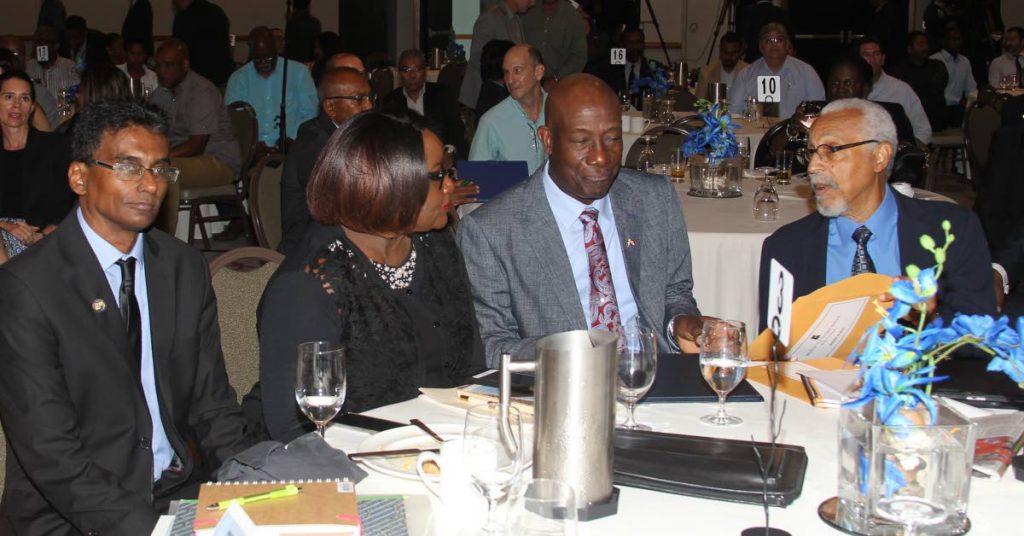 Prime Minister Dr Keith Rowley, 2nd from right, with James Armstrong, right, and Planning Minister Camille Robinson-Regis, 2nd from left at the JCC’s breakfast meeting on Tuesday. PHOTO BY RATTAN JADOO