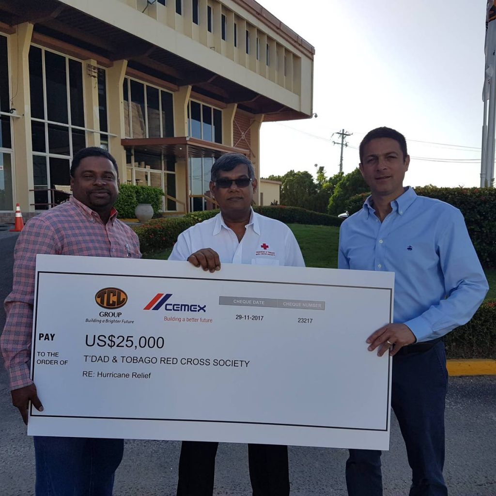 TCL donation to The Red Cross: (Left to right) Rodney Cowan, marketing manager of Trinidad Cement Limited (TCL), Lister Ramjohn, president of the TT Red Cross Society and Rodolfo Martinez, general manager of TCL. PHOTO COURTESY TCL.