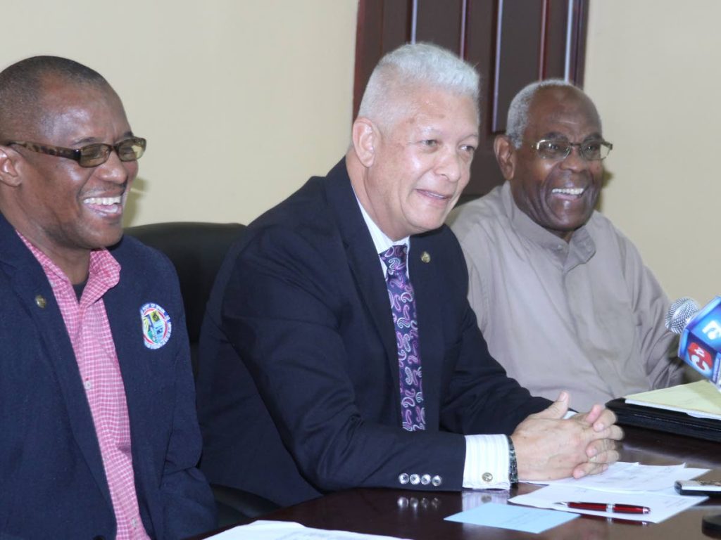 Port of Spain Mayor Joel Martinez, centre, flanked by former mayor Murchison Brown, right, and Alderman Wendell Stephen on Tuesday at a press conference. PHOTO BY ROGER JACOB