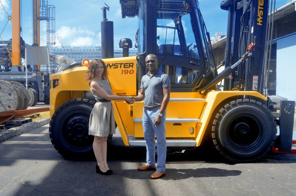 The ANSA McAL Automotive Division presents the Barbados Port with Hyster material handling equipment: (Left to right) Kim Grimshaw, Burmac's Sales Manager for the Caribbean and David Jean Marie, CEO of Barbados Port Inc during the recent handover of the first in a series of shipments of Hyster material handling equipment. PHOTO COURTESY ANSA MCAL.
