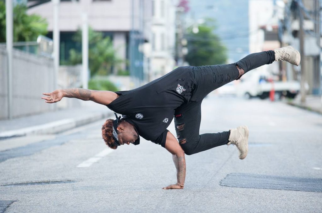 Shaakir “Turbo” Griffith does a handstand on the streets of Port of Spain. 