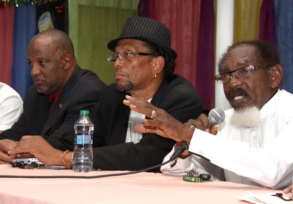 National Calypso Monarch Hollis “Chalkdust” Liverpool speaks at a news conference held at the SWWTU Hall, Port of Spain on Tuesday about the possible closure of the Kalypso Revue tent.  With him is tent manager Michael “Sugar Aloes” Osouna and calypsonian Eric “Pink Panther” Taylor.