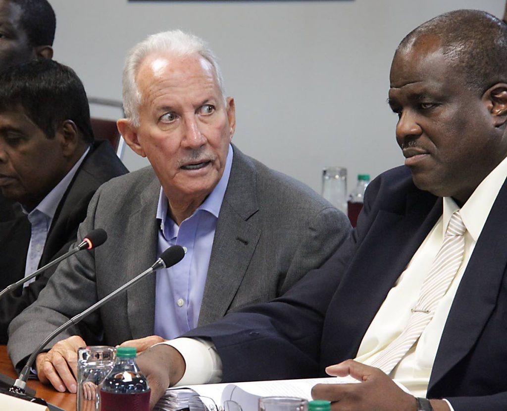 Petrotrin Chairman Wilfred Espinet, left, reacts while giving his submission during a sitting of Parliament’s Joint Select Committee on Energy while Petrotrin President Fitzroy Harewood looks on yesterday.