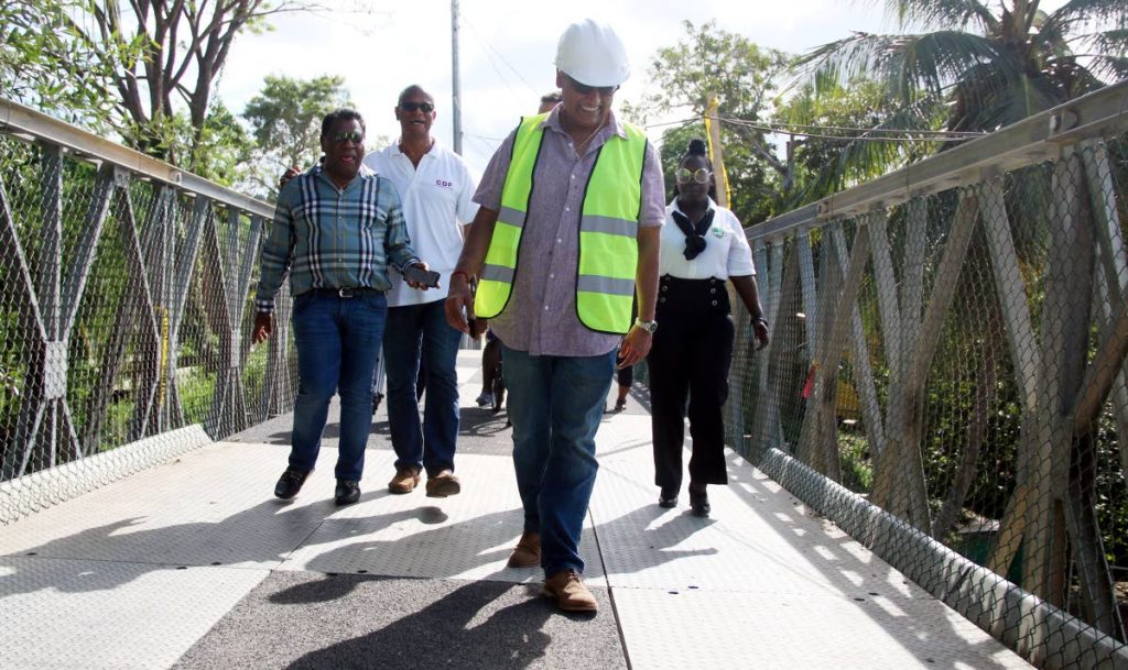 Works and Transport Minister Rohan Sinanan tests the Bailey bridge which was built at Theresa Street, Marabella.