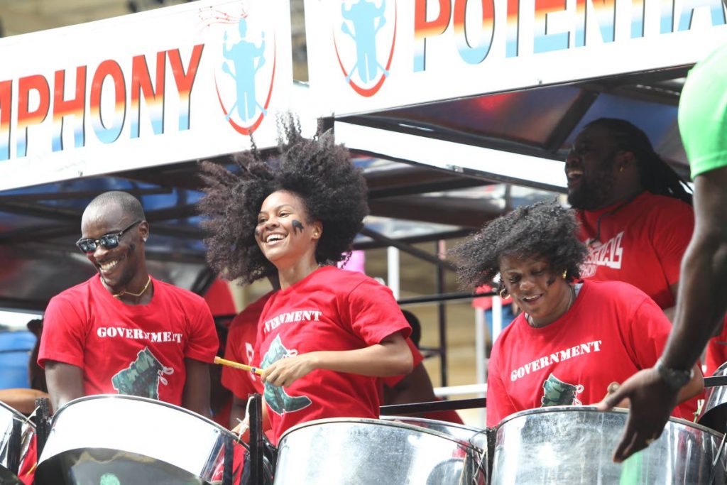 Potential Symphony players enjoy themselves during their rendition of Government Boots by Gabby at the National Panorama (medium bands) semis at the Queen’s Park Savannah yesterday.