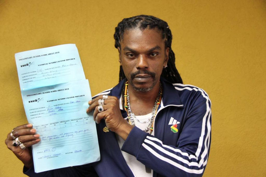 AH VEX: Calypsonian Bro Musa displays his score sheets which he admitted to snatching from the TUCO office and running away. PHOTO BY SUREASH CHOLAI.