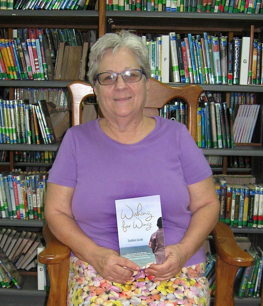 Debbie Jacob with a copy of her book Wishing for Wings inspired by the YTC inmates she taught. Among them was Jahmai Donaldson who was gunned down with another man on January 10.