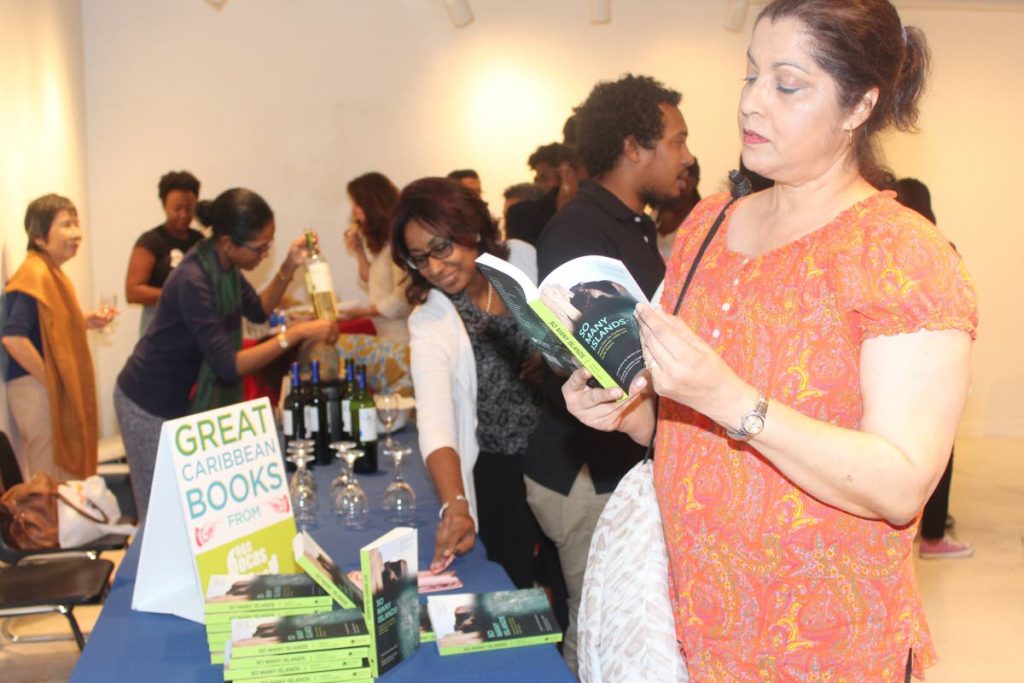 Gita Naipaul reads a copy of So Many Islands.