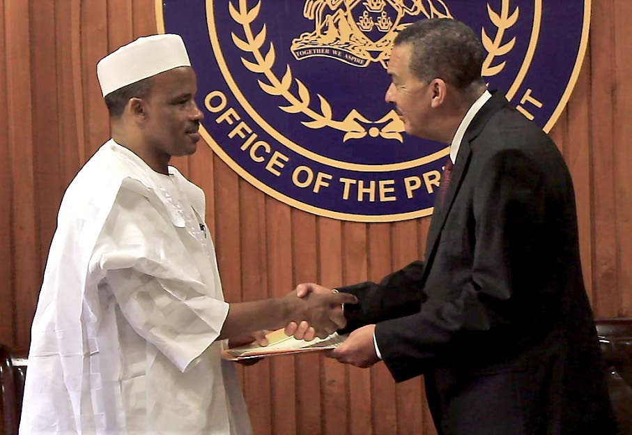 WELCOME TO TT: President Anthony Carmona, right, receives credentials from new Nigerian High Commissioner Jika Ardo Hassan on Tuesday at the Office of the President in St Ann’s. PHOTO BY RATTAN JADOO