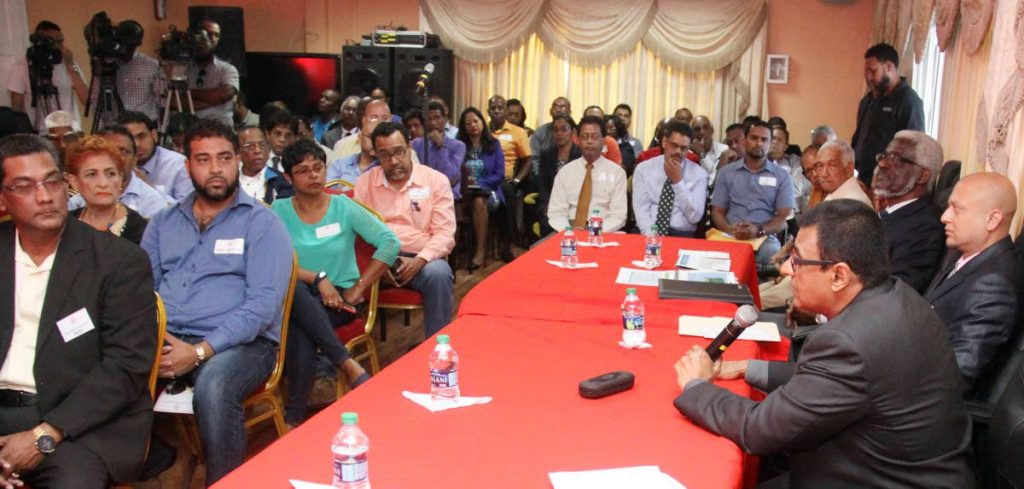 HIGHWAY TALKS: Works and Transport Minister Rohan Sinanan, right, speaks at a meeting yesterday in Sangre Grande with businessmen to discuss issues pertinent to the Eastern town. PHOTO BY ANGELO MARCELLE