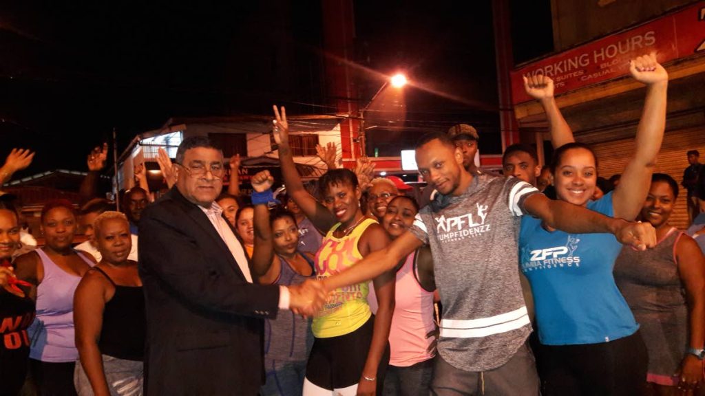 Chairman of the Sangre Grande Regional Corporation Terry Rondon, front left, shakes the hand of instructor Chris Portillo following an aerobics burnout on Wednesday in Sangre Grande.
