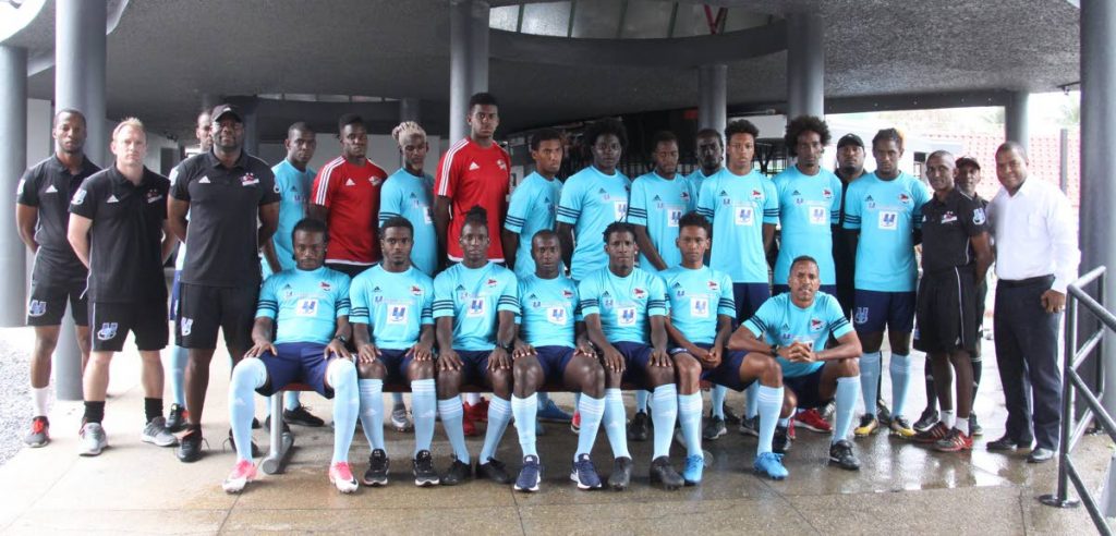 Players and technical staff of Central FC pose for a team photo yesterday, at the Marvin Lee Stadium, Macoya, for the unveiling of the squad that is heading to the Dominican Republic tomorrow to compete in the CONCACAF Caribbean Club Championships which starts on February 7.