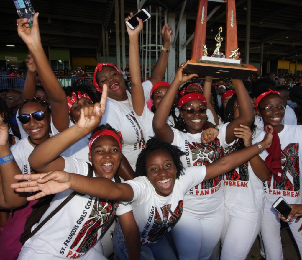 WE WIN!: Overjoyed students of St Francois Girl College celebrate after regaining the Junior Panorama (Seconday Schools) crown yesterday at the Queen’s Park Savannah. PHOTO BY ROGER JACOB