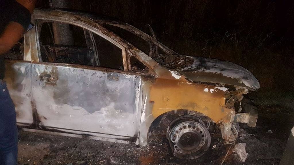 Photo of Singh's burnt out Nissan Tiida