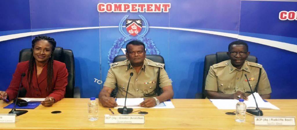 POLICE SPEAK: Police corporate communications director Ellen Lewis, Ag DCP Deodath Dulalchan and Ag ACP Radcliffe Boxhill at the weekly press briefing yesterday.  PHOTO COURTESY TTPS