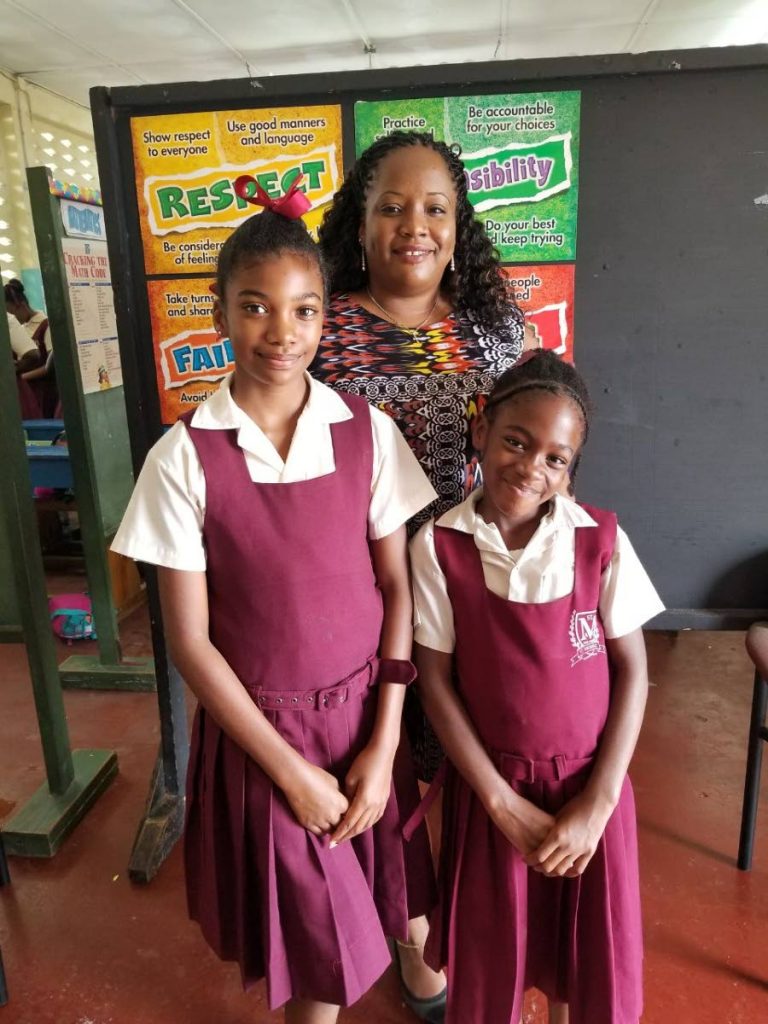 ST MICHAEL’S PRIDE: Principal of St Michael’s Anglican primary school Monique Celestine Daniel with reigning junior Chutney Soca monarch Jayda Celestine, right, and schoolmate Leshawna Williams who placed 4th in the competition 
on Wednesday.