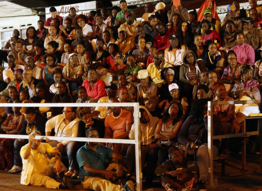 The large crowd which turned out to see the re-enactment of the Canboulay riots at Picadilly Greens, Port of Spain yesterday.   