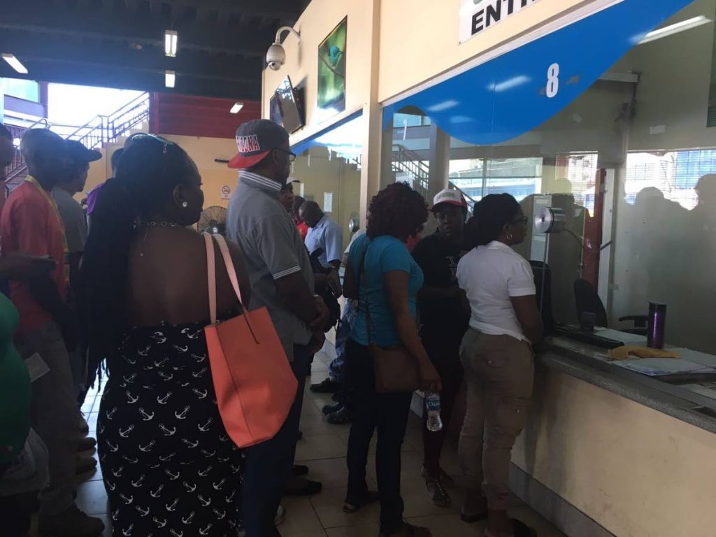 Disgruntled ferry passengers at the Port of Spain Ferry Terminal yesterday.  PHOTO BY CARLA BRIDGLAL