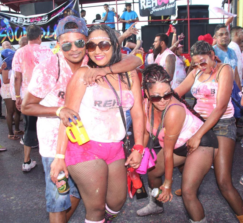 Members fron the band Socaholics enjoying themselves on J’Ouvert morning.