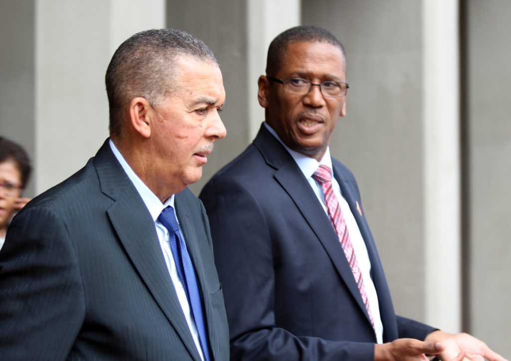 A BUSY MAN: President Anthony Carmona, left, seen in this file photo with Chief Justice Ivor Archie, was too busy yesterday to deal with queries from the Prime Minister on Archie’s six month sabbatical leave.
