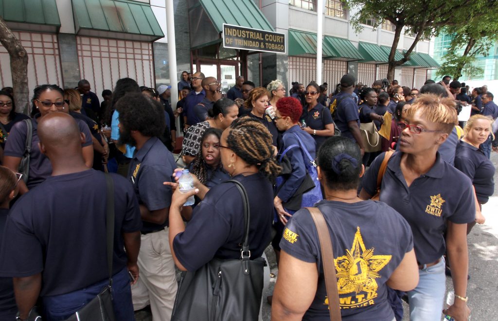 UTT workers outside the Industrial Court in Port of Spain on Monday. PHOTO BY ROGER JACOB