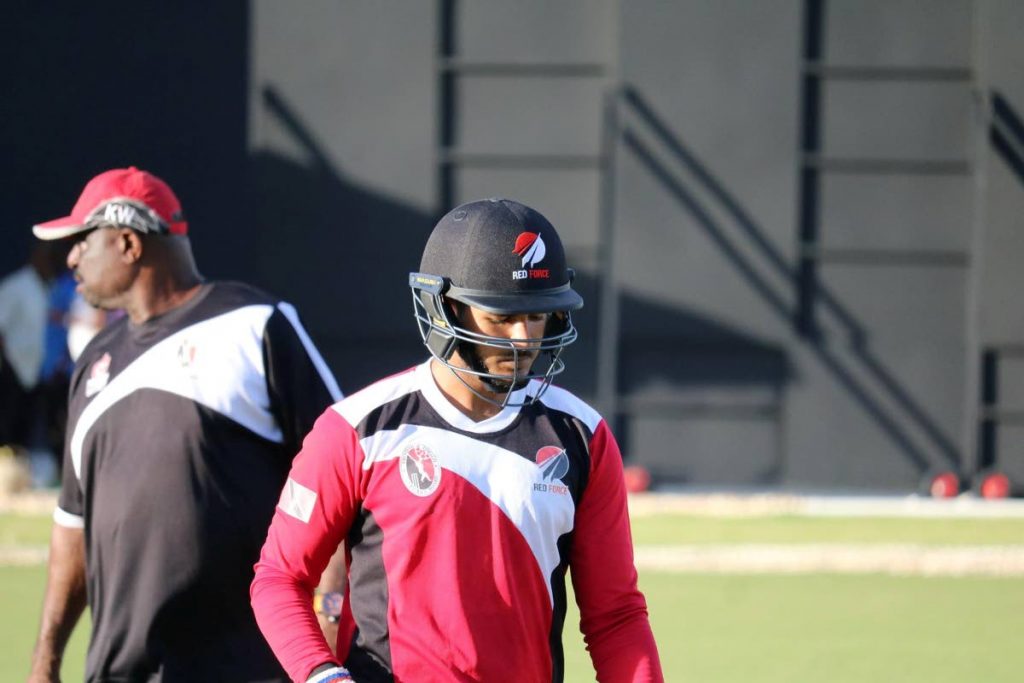 FLASHBACK: Red Force batsman Amir Jangoo, right, in a training session last year at the Brian Lara 
Academy in Tarouba as coach kelvin Williams, left, keeps an eye on proceedings.