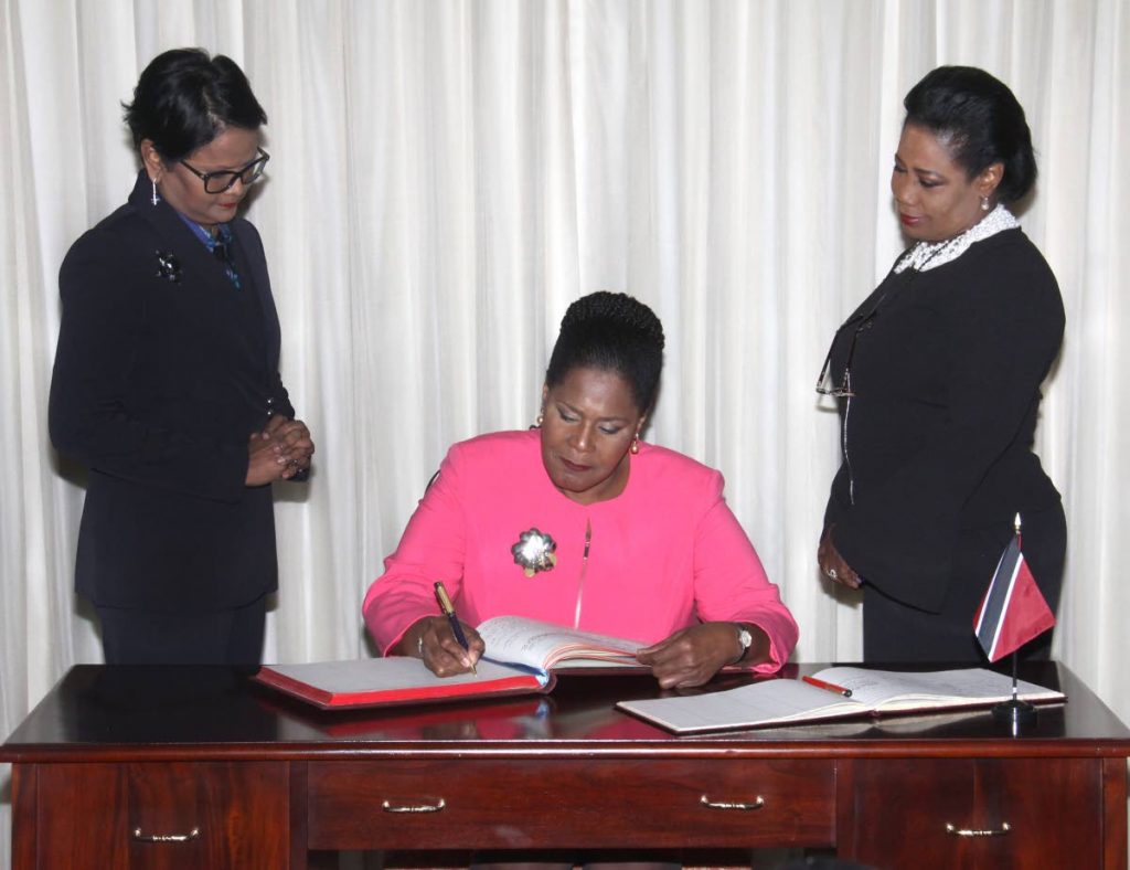 Signing upon receiving her instruments of election confirming her as the Electoral College’s unanimous choice as TT’s next President.