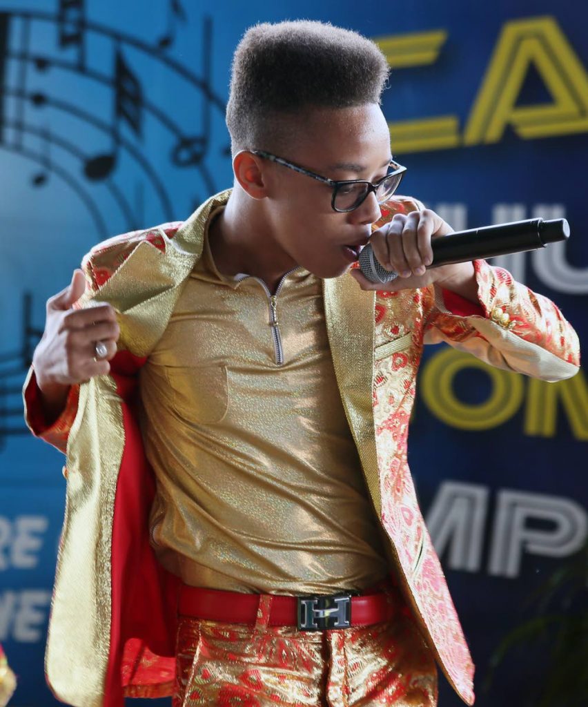 MOVING ON: Five-time Schools National Carnival Intellectual Chutney Soca Monarch champ Aaron Duncan during his winning performance yesterday at the Queen’s Park Savannah.