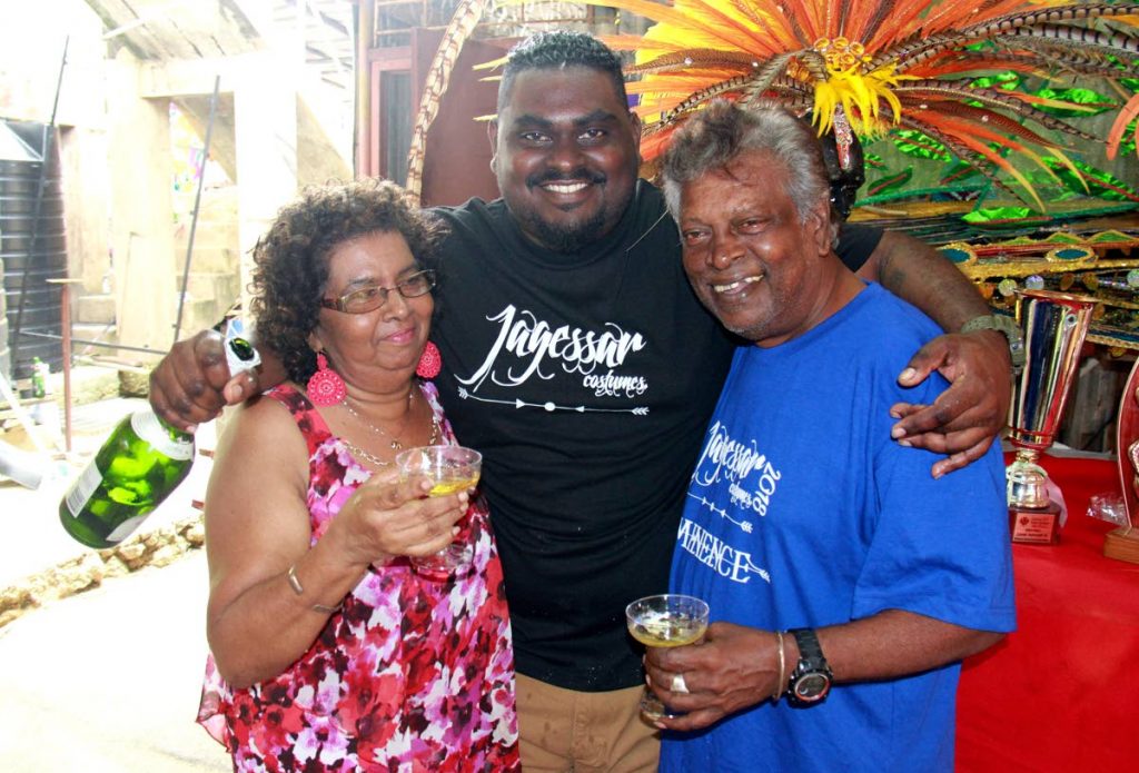 VICTORY: Rose Marie Jagessar, her husband Lionel and their son 
Lionel Jnr celebrate their band Lionel Jagessar and Associates winning the San Fernando Band of the Year title.   PHOTO BY ANIL RAMPERSAD