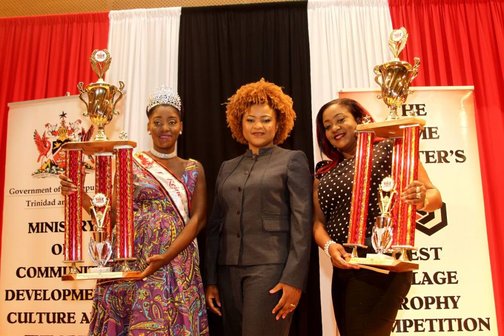 BEST WOMEN: Culture Minister Dr Nyan Gadsby-Dolly is flanked by Miss La Reine Rive winner Rayshawn Pierre (left) from the North West Laventille Cultural Movement and winner of the Folk Theatre, Lieselle John-Clarke at yesterday’s Prime Minister’s Best Village prize distribution and launch of 2018 competition.