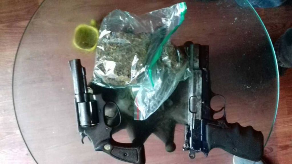 File photo: The two firearms and marijuana seized by police during a raid 
on an apartment in South Trinidad.