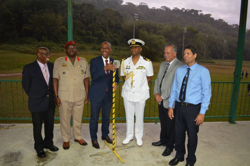 (from left) Anthony Bartholomew, Technical Advisor to the Minister of Public Utilities; Colonel Colin Mitchell, Commanding Officer of the Trinidad and Tobago Defence Force; Minister of Public Utilities, Robert Le Hunte’ Chief of Defence Staff, Commodore Hayden Pritchard; Keith Sirju, Chairman of T&TEC and Kelvin Ramsook, General Manager of T&TEC, at the commissioning of the lights at the Defence Force Reserves Playing Field in Chaguaramas.
