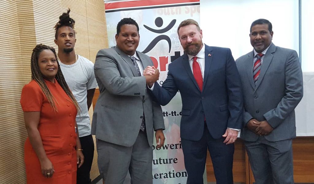 Technical Director of Cycling Erin Hartwell, second from right, greets Sports Minister Darryl Smith at his unveiling last year. At right is Sport Company Chairman Dinanath Ramnarine, while TT Cycling Federation PRO Roxanne Ramnath, left, stands alongside national cyclist Njisane Phillip.