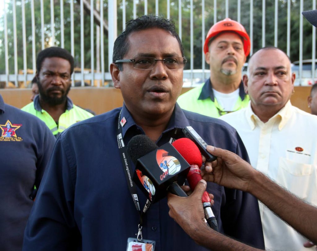 Ahmad Mohammed, TCL’s OWTU branch president speaking with reporters yesterday in front the company’s Claxton Bay plant yesterday.