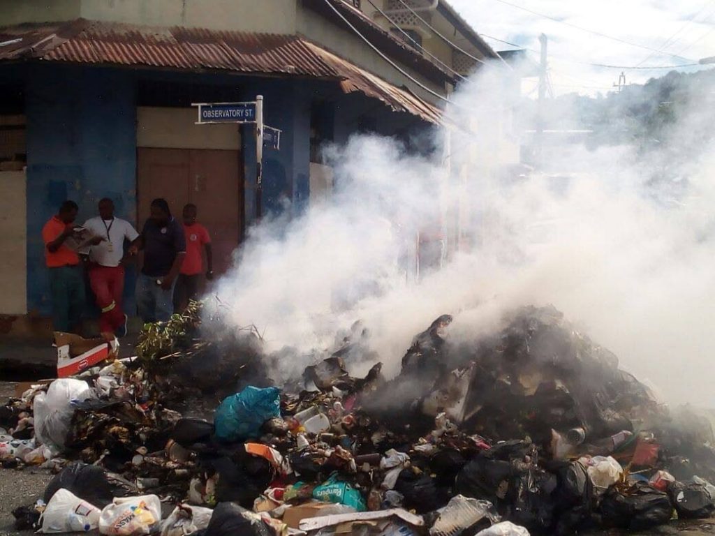 DUMPED: Garbage dumped on Observatory Street in Port of Spain burns on Monday during protests over the killing by police of Akel “Christmas” James. PHOTO BY RYAN HAMILTON-DAVIS