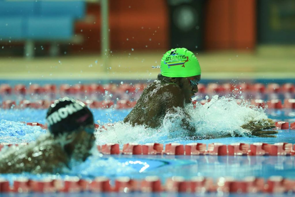 Jeron Thompson of Atlantis Aquatics, right, placed first in the boys 15-17 50m breaststroke at the ASATT National Age Group Long Course Championships at the National Aquatic Centre, Couva, Saturday.