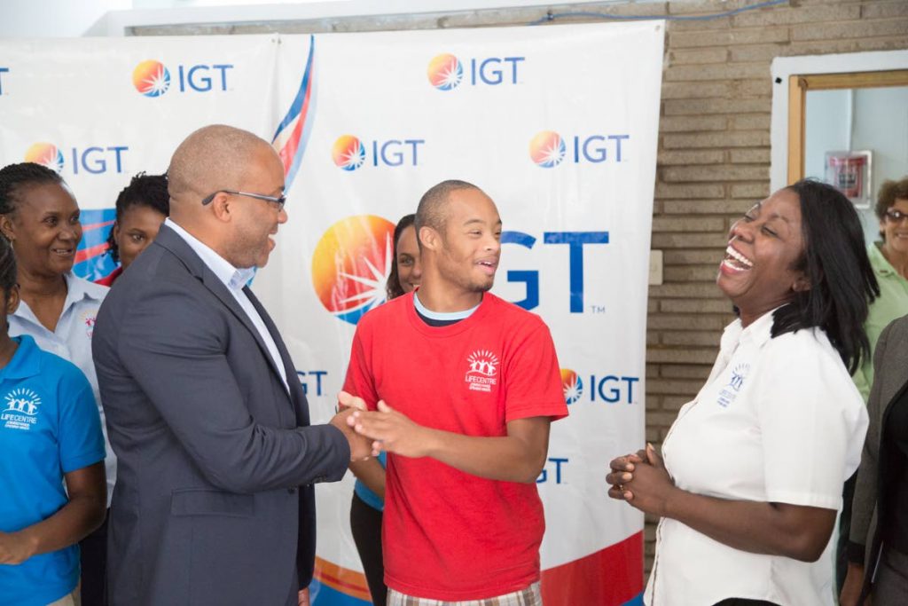 Student at the Life Centre Zane Evans, centre, shares a joke with Patrick Clunis, IGT’s deputy country manager and Lillon Ryan-Dick, programme coordinator at the Life Centre. 