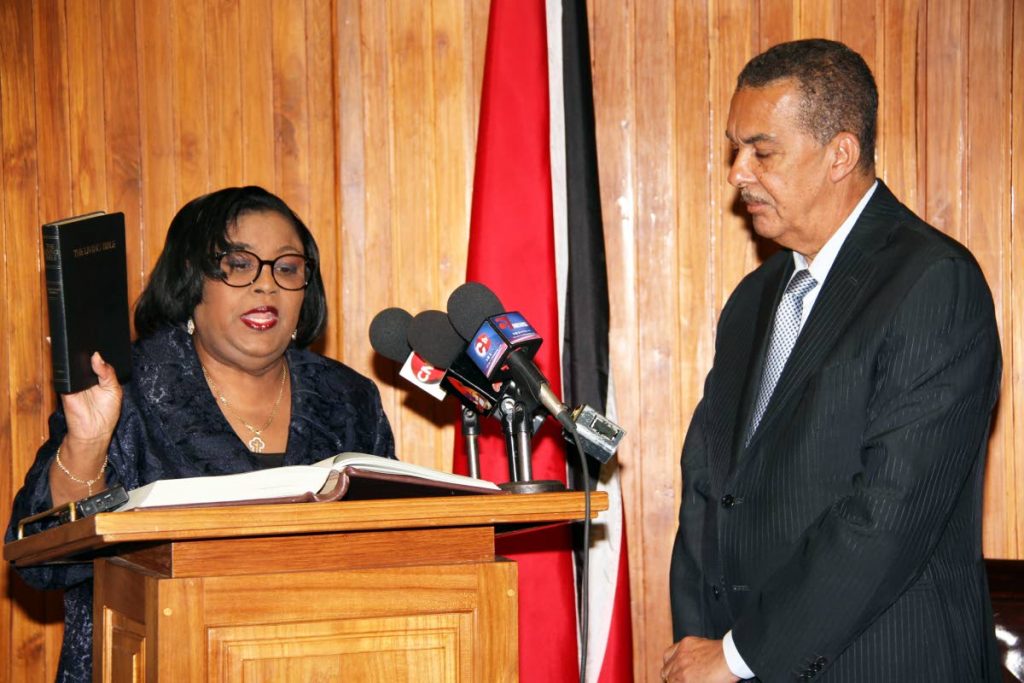 President Anthony Carmona administering the oath of office to Marlene Mc Donald as Minister in the Ministry of Public Administration and Communications at the Office of the President. PHOTO SUREASH CHOLAI