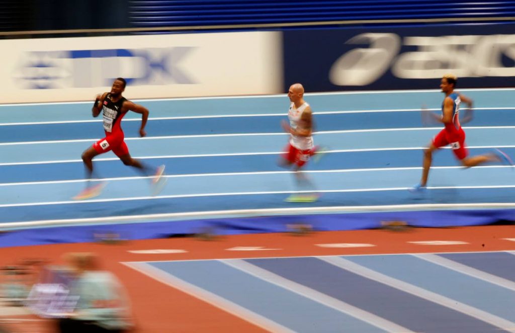 TT’s Deon Lendore, left, participates in the men’s 400m heats at the World Athletics Indoor Championships in Birmingham, Britain, yesterday. Lendore will run in today’s final. AP Photo