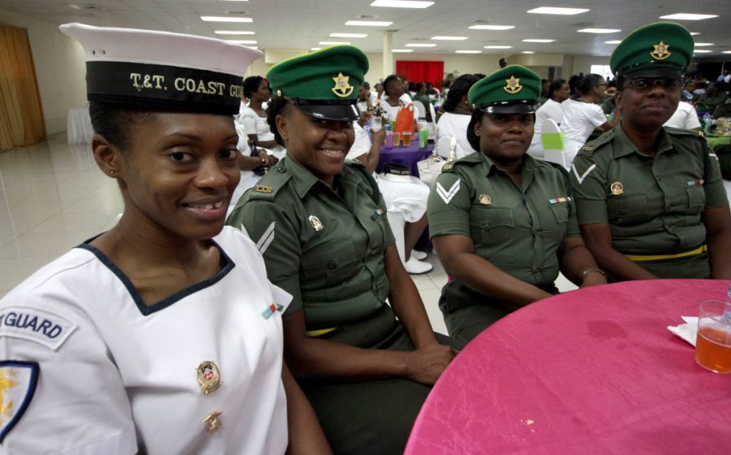 DEFENDERS OF TT: From left, Leading Seawoman Tricia Liverpool, Cpl Vanessa Brown, Cpl Carlene Martinez and Lance Cpl Petel Friday, yesteray at the Defence Force’s women’s conference at Regiment Headquarters in Aranguez.