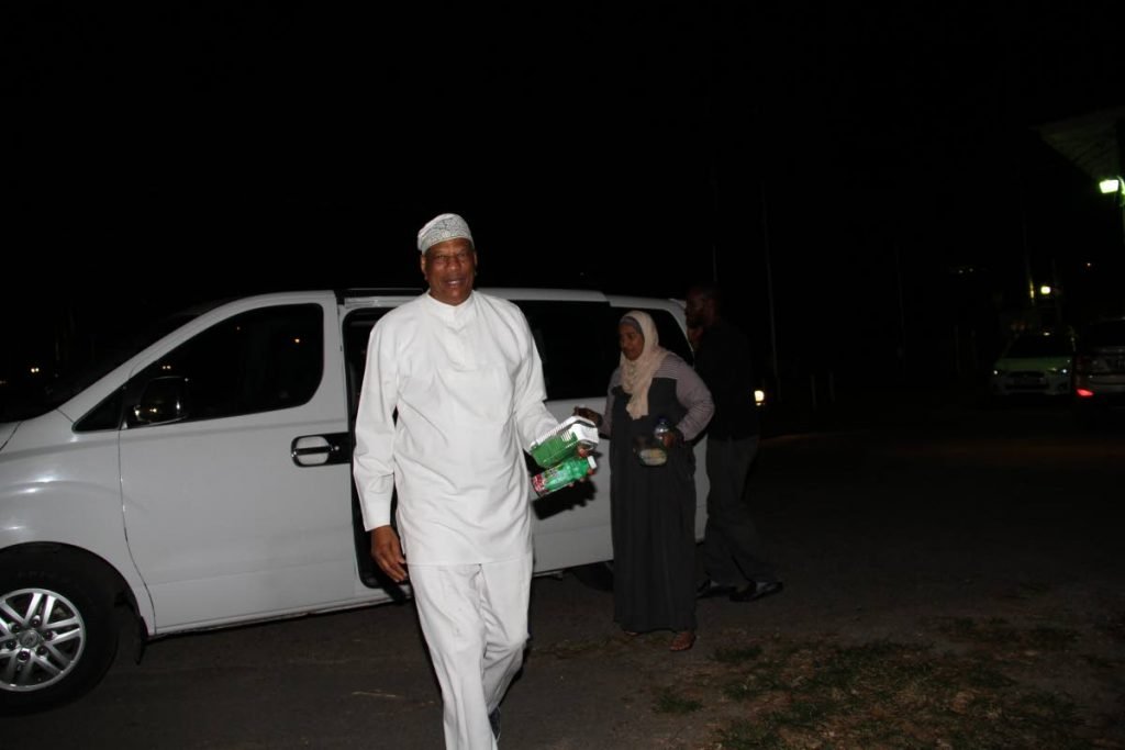 Imam Yasin Abu Bakr comes out of a shuttle provided by the Office of the Prime Minister on Wednesday night after a meeting between Prime Minister Dr Keith Rowley and Muslim leaders at the Diplomatic Centre in St Ann's.